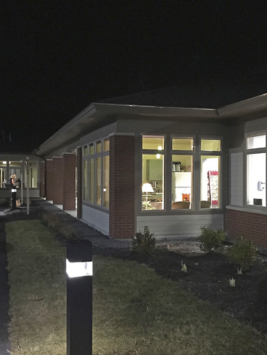 Color photo taken at night of New England Cancer Specialists' exterior, West Kennebunk, Maine.