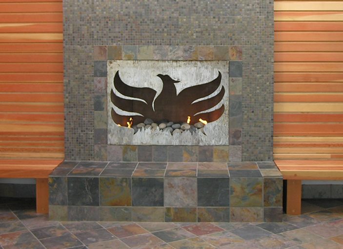 Custom fireplace screen with phoenix cut-out.