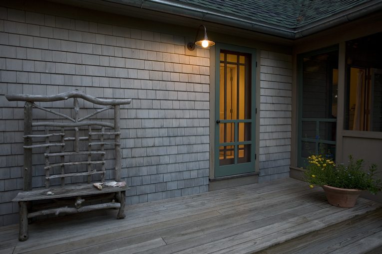 Master suite deck and entry detail at summer cottage. Designed by Whipple|Callender Architects.