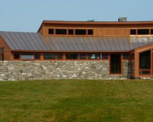 Curved House in a Field